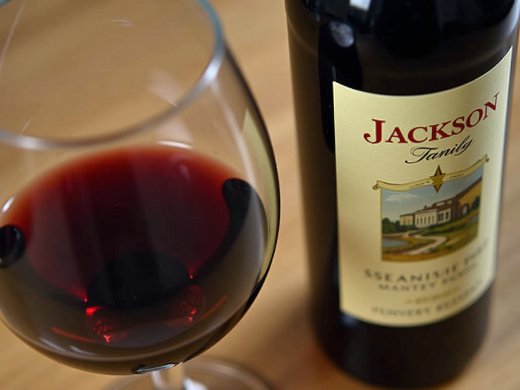 A glass of red wine from Jackson Family Wines, highlighting the quality and craftsmanship of their wines.